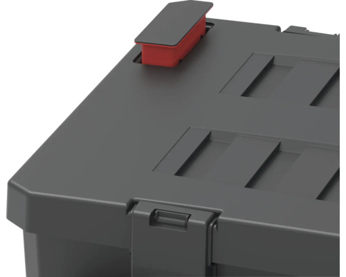 Vue détaillée d''un conteneur de rangement gris avec une fermeture rouge