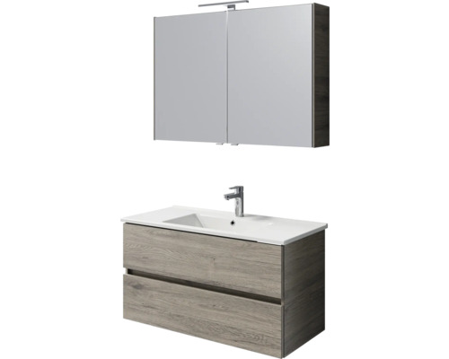 Waschtisch mit Unterschrank und Spiegelschrank mit Beleuchtung im Badezimmer