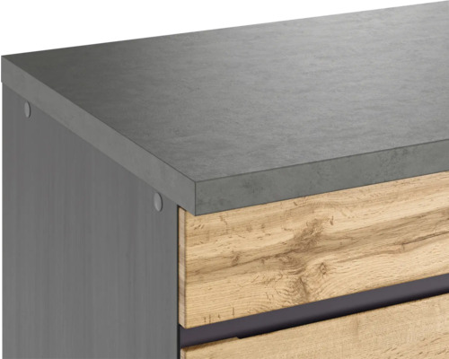 Gros plan d''un meuble bas de salle de bains avec tiroirs en bois et plan de travail en béton