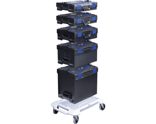 Pile de boîtes à outils noires avec accent bleu sur un plateau à roulettes