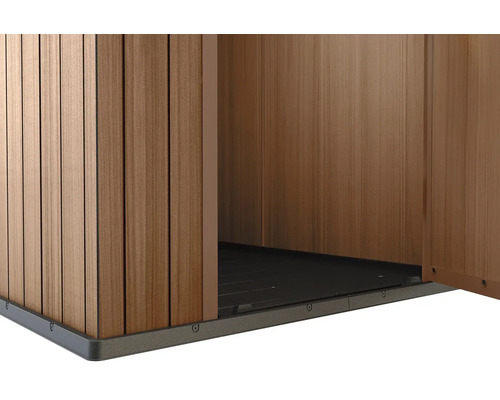Detailansicht eines Gartenhauses mit Holzwand und Bodenplatte