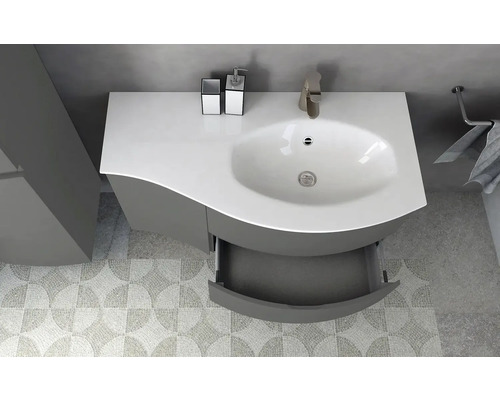 Vue de dessus d''un meuble de salle de bain avec lavabo, robinet, distributeur de savon et serviette