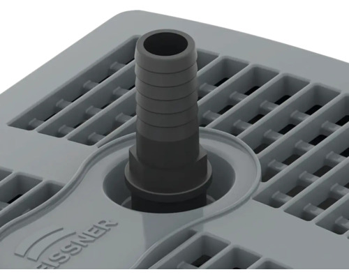 Vue de dessus d''une grille d''évacuation en plastique avec raccord de tuyau