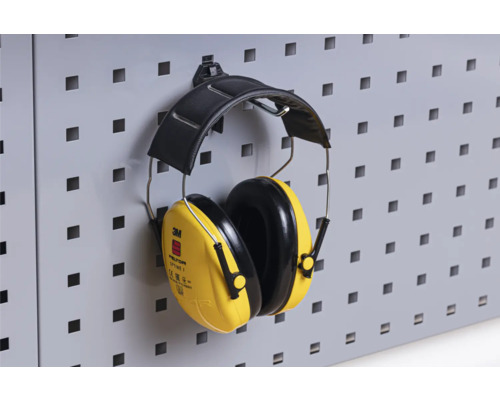 Casque antibruit jaune 3M Peltor Optime I suspendu à un panneau perforé