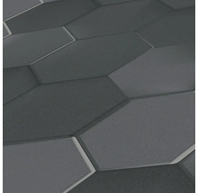 Nahaufnahme einer grauen Wand mit sechseckigem Muster