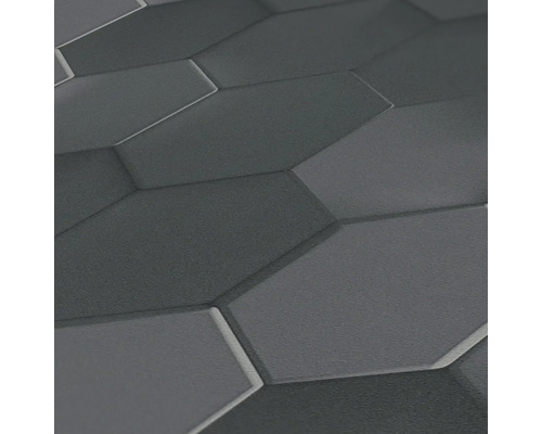 Nahaufnahme einer grauen Wand mit sechseckigem Muster