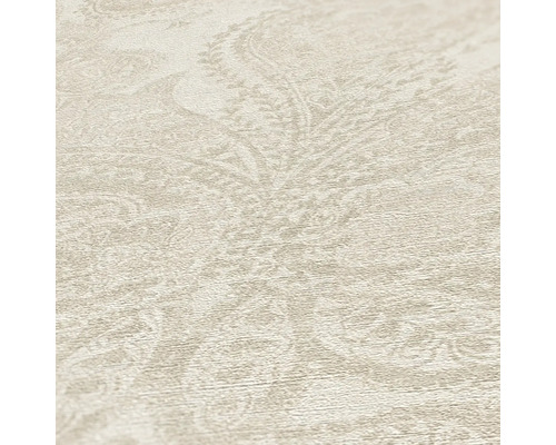 Gros plan d''un papier peint vinyle beige avec motif cachemire.