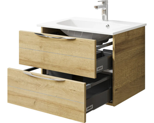 Meuble sous-vasque avec deux tiroirs ouverts et lavabo