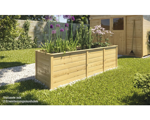Jardinière en bois avec plantes et deux modules d''extension dans le jardin