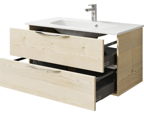 Meuble sous-vasque avec deux tiroirs ouverts, lavabo et robinet