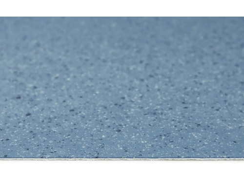 Gros plan d''un sol en vinyle bleu avec un motif moucheté