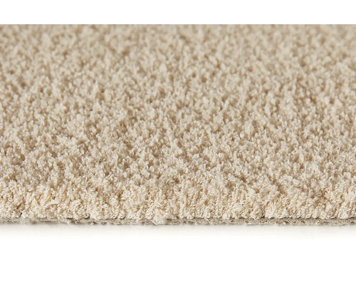 Nahaufnahme eines beigefarbenen Teppichs mit Schlingenstruktur