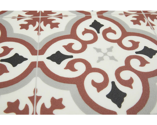 Fliesen mit floralem Muster in Grau-, Schwarz- und Brauntönen