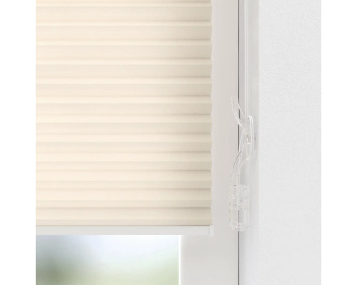 Gros plan d''un store plissé beige pour fenêtre avec commande