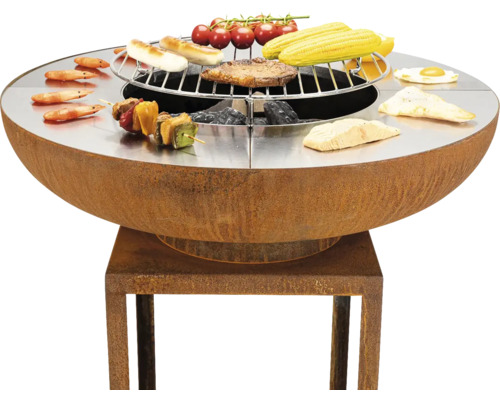 Runder Grilltisch mit Grillrost und verschiedenen Speisen.