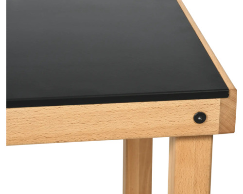 Vue détaillée d''un bureau avec plateau noir et structure en bois.