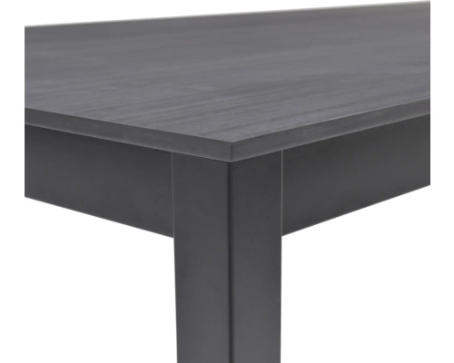 Detailansicht eines Tisches mit Tischplatte und Tischbein