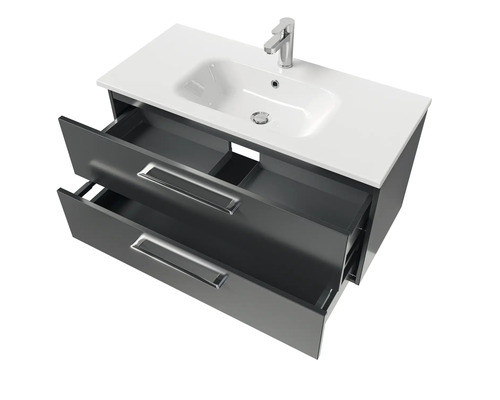 Meuble sous-vasque avec deux tiroirs ouverts, lavabo en céramique et robinet