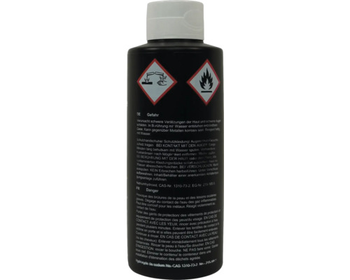 Produit corrosif dans une bouteille noire