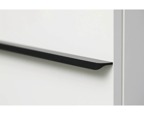 Poignée de meuble noire sur surface blanche