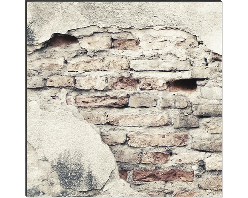 Mur de briques endommagé avec du plâtre