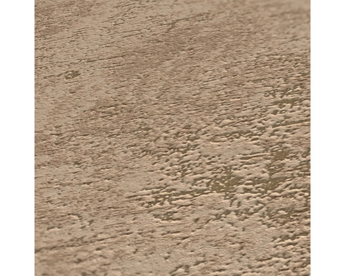 Gros plan d''une surface en crépi structuré beige.