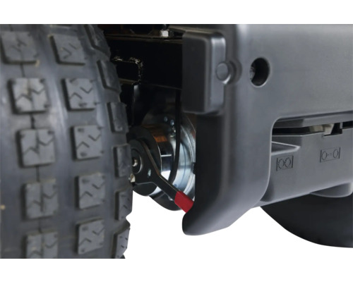 Vue détaillée de la roue et du frein d''un tracteur de pelouse