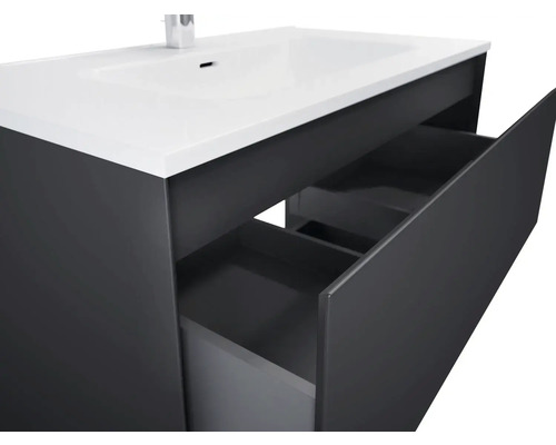 Meuble sous-lavabo avec tiroirs ouverts pour salle de bain