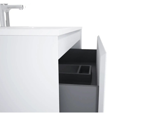 Meuble sous-lavabo avec tiroir ouvert et robinet de lavabo