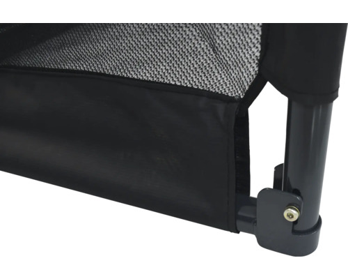 Gros plan d''un lit pour chien noir avec filet.