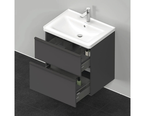 Meuble sous-vasque avec deux tiroirs ouverts et lavabo en céramique
