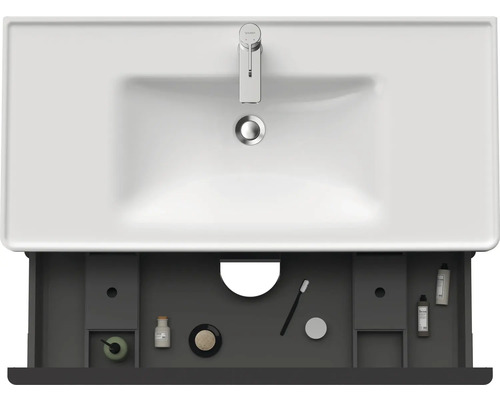 Meuble-lavabo avec tiroir ouvert pour ranger les articles de salle de bains et les accessoires