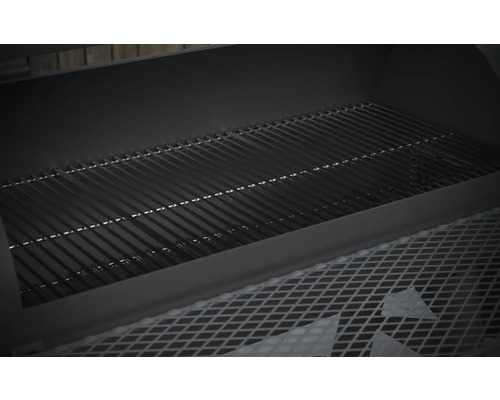 Vue intérieure d''un barbecue au charbon de bois avec grille