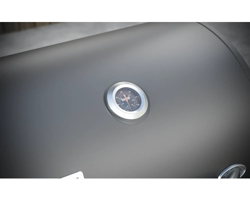 Detailaufnahme eines Grilldeckels mit Temperaturanzeige.