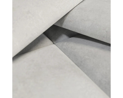 Gros plan de pavés en béton gris clair.