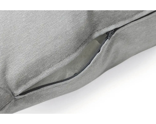 Gros plan d''un coussin gris avec fermeture éclair