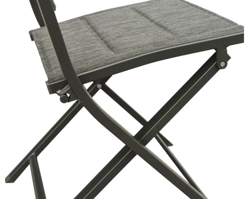 Vue détaillée d''une chaise pliante avec revêtement en tissu