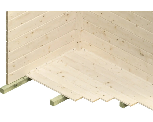 Ecke einer Holzwand mit Nut- und Federverbindung und Holzboden auf Balken