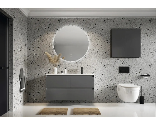Salle de bains moderne avec meuble sous-vasque, miroir avec éclairage et WC suspendu.