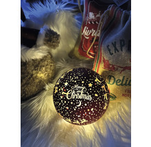 Boule lumineuse décorative avec motif de Noël sur un fond duveteux