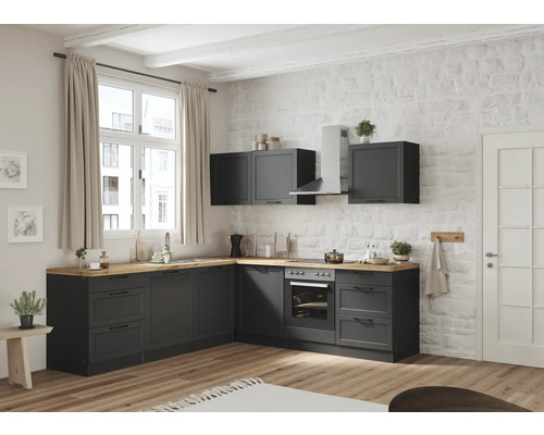 Cuisine lumineuse avec armoires basses grises, plan de travail en bois et murs blancs