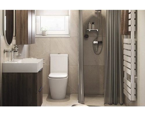 Badezimmer mit Waschtisch, Toilette, Dusche und Handtuchwärmer.