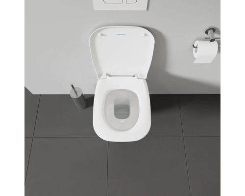 Vue de dessus de toilettes avec couvercle ouvert et dérouleur de papier toilette.