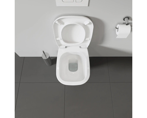 Vue de dessus de toilettes avec couvercle ouvert dans une salle de bains.