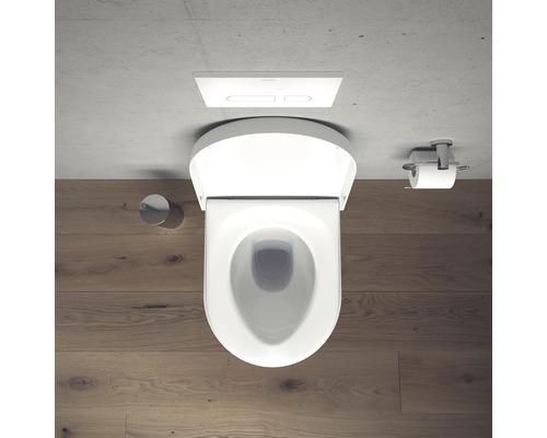 Vue de dessus de toilettes avec plaque de commande et porte-papier toilette