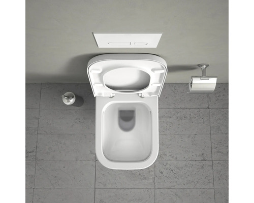 Vue de dessus de toilettes blanches avec couvercle ouvert et réservoir