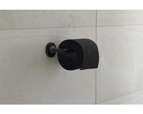 Papier toilette noir sur support mural carrelé