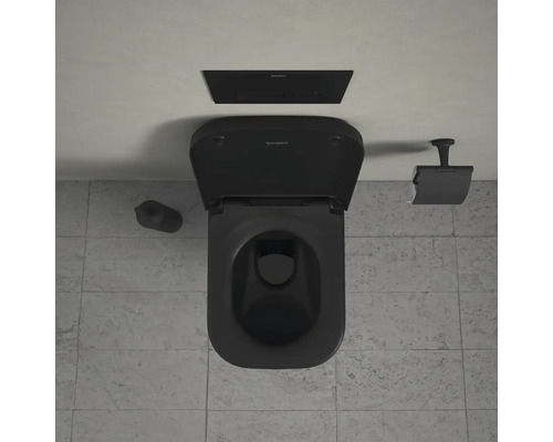 Toilettes noires avec réservoir, brosse de toilette et porte-papier