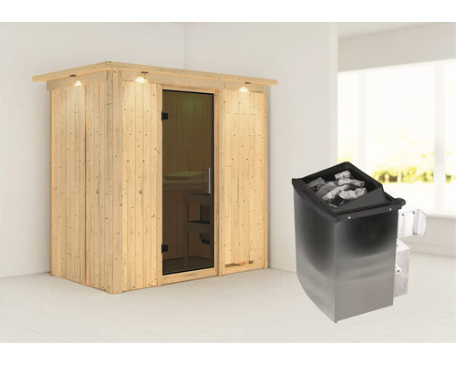 Sauna en bois avec poêle de sauna et pierres de sauna dans une pièce lumineuse.