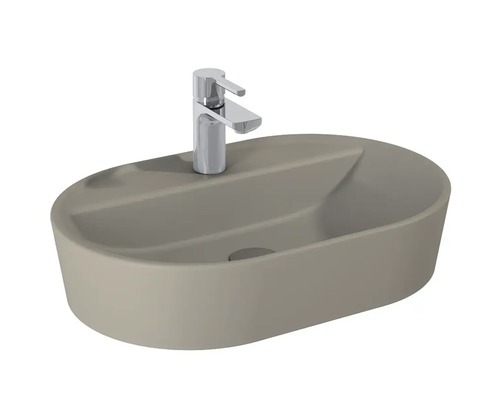 Vasque à poser de forme ovale avec robinetterie